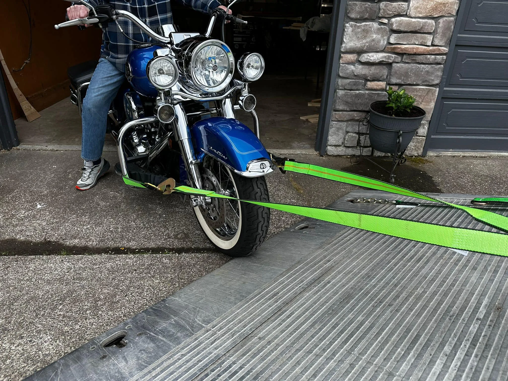 Motorcycle secured for flatbed transport by Bernabe Towing & Recovery.
