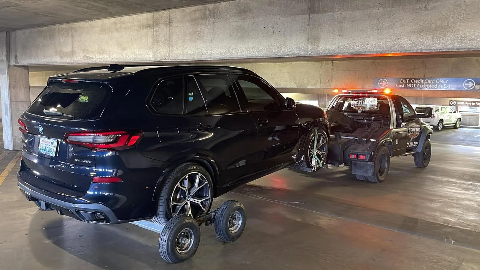 Bernabe Towing operating inside a parking garage