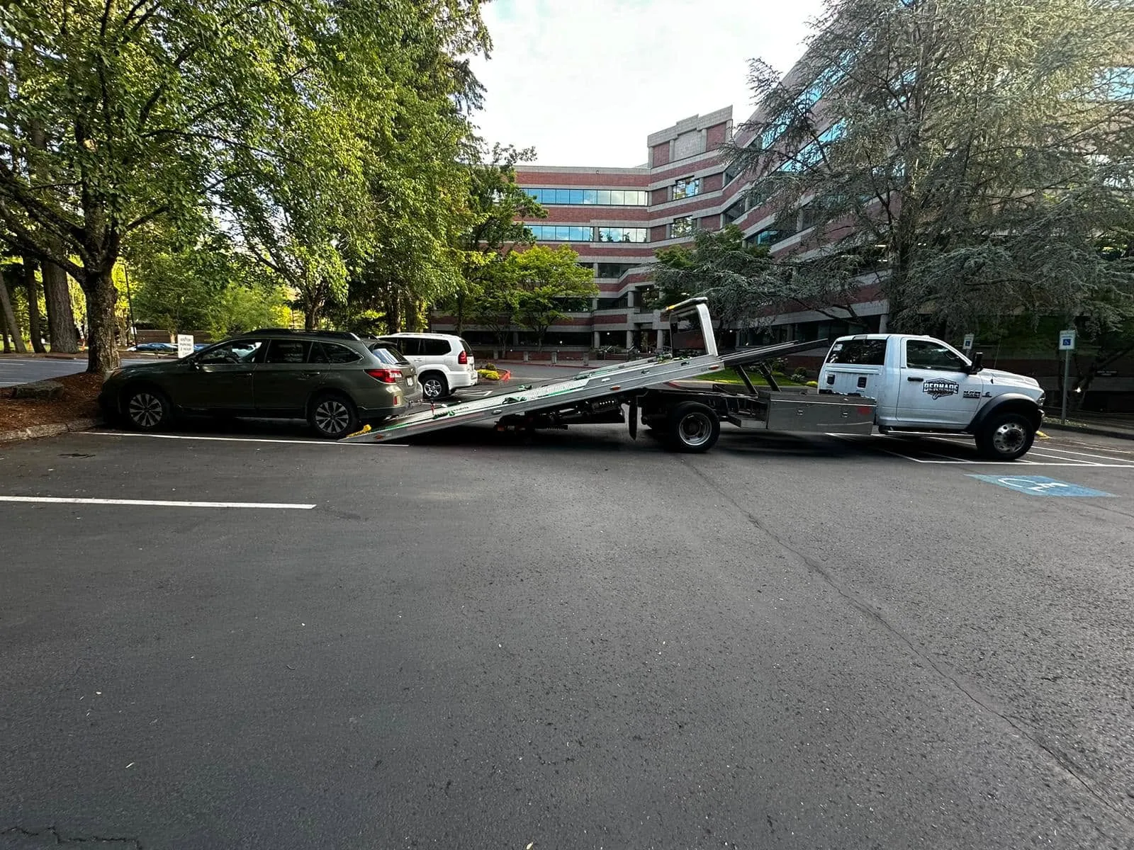 Flatbed towing at an office property